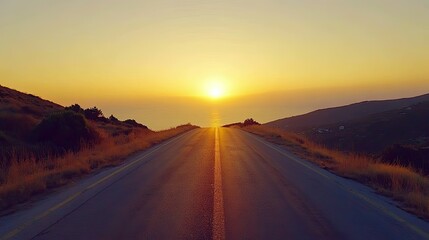Fototapeta premium Empty road stretching into the horizon at sunset, evoking freedom and the limitless opportunities of travel.