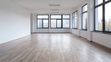 Fototapeta premium Spacious empty office with large windows and wooden floor