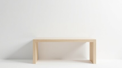 Simple light wood console table against a white wall