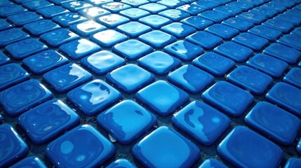 Fototapeta premium A vibrant perspective of a patterned surface composed of numerous glossy, azure square tiles arranged in a grid-like formation.