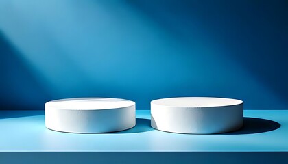 white product display stands sit on a blue surface, illuminated.