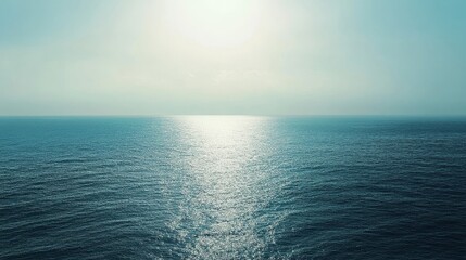Fototapeta premium The vast sea stretches endlessly between the sky and earth, melding the horizon where the sea meets the sky, offering a serene view that captivates the soul and inspires endless thoughts of peace.
