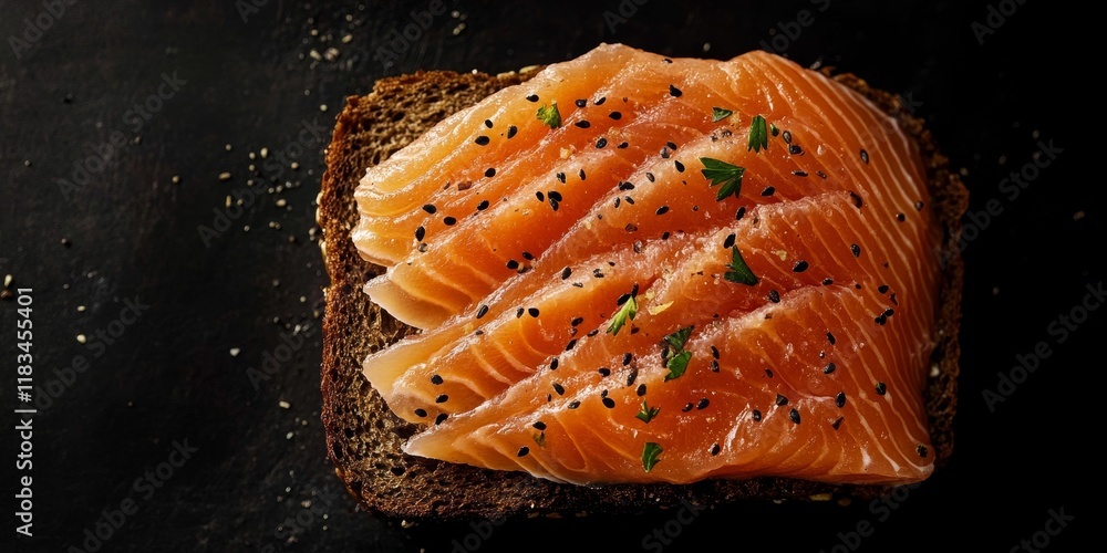 Aufkleber salmon served on brown bread against a black background, creating a captivating top view. this image