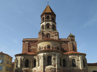 Fototapeta premium Romanesque Abbey of Saint-Austremoine. Issoire. Auvergne. France. 12th century. General view of the apses and the bell tower. 