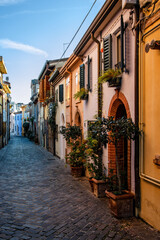 Early morning view to picturesque street Via Marecchia in Rimini, Italy.