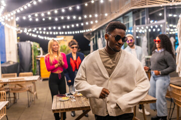 Cool african man dancing in a night roof bar party