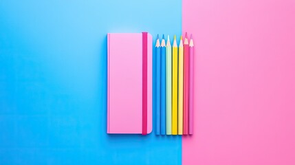 Bright flat lay of colorful pencils and notebooks arranged on a pastel pink and blue background with copy space. Perfect for school or creative projects.