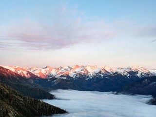 Sunset and Snow-covered mountains with mist at Sequoia National Park