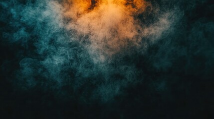 Obraz premium Teal and orange smoke on black background.