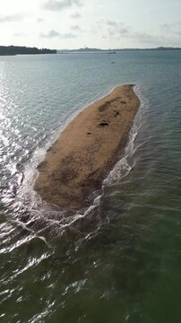 Paku Island is a small island in bintan. There are no trees. The island is in the middle of an ocean filled with brown sand