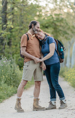 Senior couple holding hands while hiking in madrid, spain