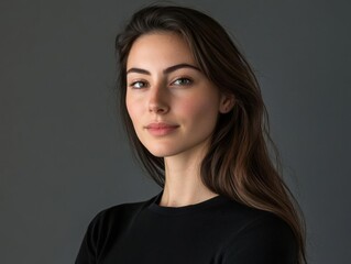 Fototapeta premium Young Woman Poses Confidently with Long Brown Hair and Simple Style, Portrait Photography Concept.