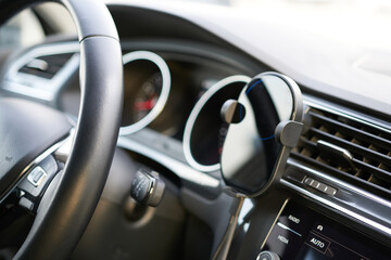 Modern car interior. Steering wheel and dashboard. Close up.