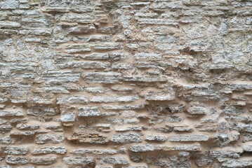 old medieval limestone bricks wall background texture