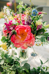 Vibrant floral arrangement with colorful blooms and lush greenery.