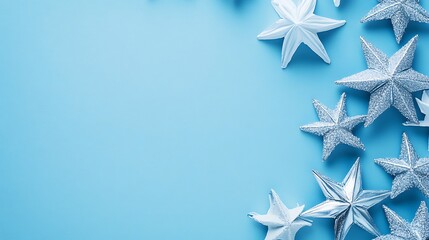 Silver and white stars on a light blue background