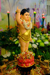 Thien Quang buddhist pagoda.  Infant Buddha statue pointing the north. On Vesak Day, Buddhists ...