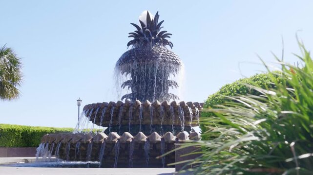Pineapple Fountain set against the backdrop of a sunny day with greenery around in Waterfront Park