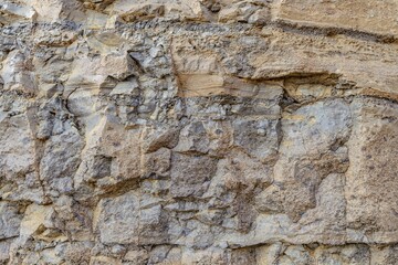 Close-up detailed shot of a natural stone texture with rugged details in Iceland