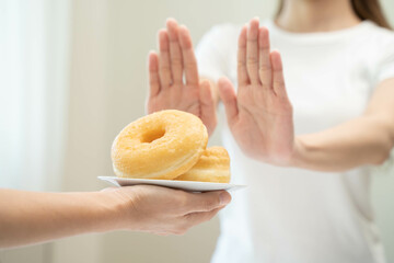 Woman choose to avoid to eat sweet and food that have high carbohydrate.