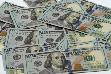 American dollar banknotes on a white background close-up.