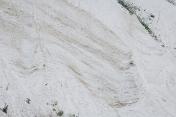 Limestone quarry. Open-cast mining. Chalk hills. Chalk surface. Natural limestone. 