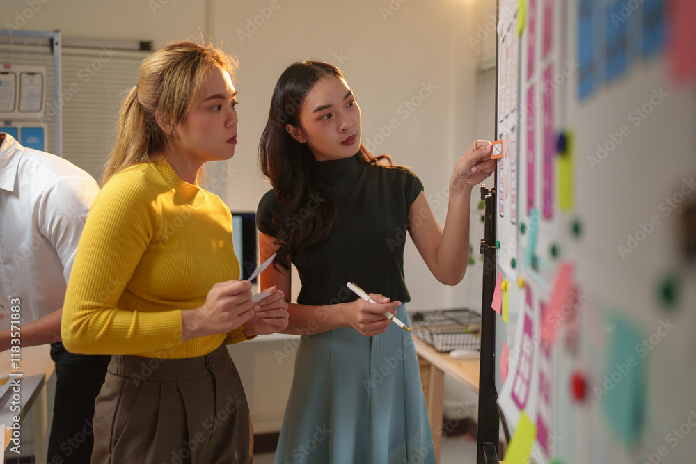 Poster two female ux designers brainstorming and discussing mobile app interface wireframe design on a whit