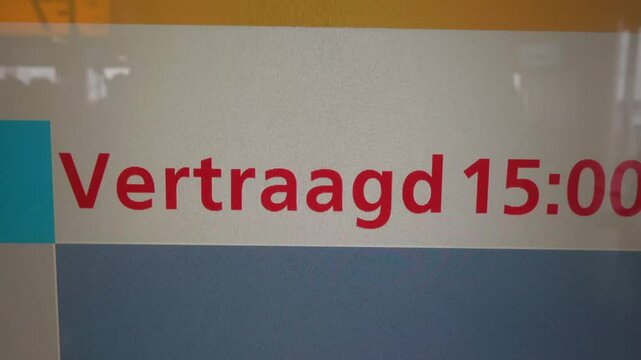 Amsterdam, Netherlands A flight information display at Schiphol Airport says Flight Delayed in English and Dutch. 