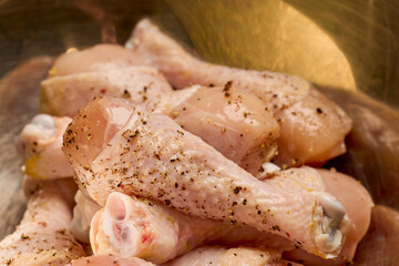 chicken legs on a wooden table