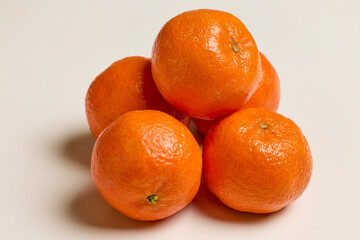 clementines placed on a white table