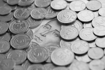 Grigory Skovoroda face from 500 Ukrainian Hryvnias money bill surrounded by silver ukrainian coins