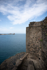 Fototapeta premium View of the Faraglioni of Acitrezza from the Norman castle of Acicastello in Sicily