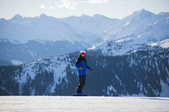 Skier on snowy slopes with majestic Kitzb&uuml;hel alpine backdrop