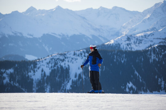Skier on snowy slopes with majestic Kitzb&uuml;hel alpine backdrop