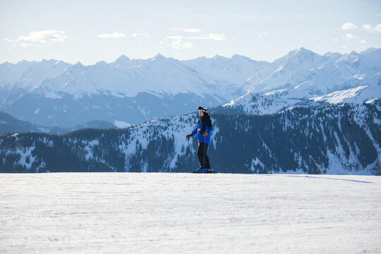 Skier on snowy slopes with majestic Kitzb&uuml;hel alpine backdrop