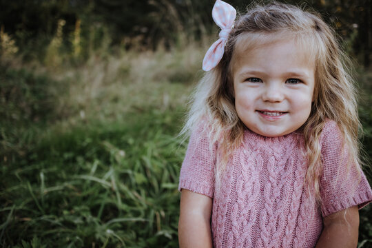 Portrait of sweet and cute giggling toddler girl, three years old.