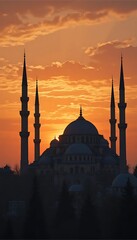 Fototapeta premium Silhouetted Mosque at Sunset: A Dramatic Architectural Scene