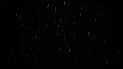 Snow on black background, slow motion, falling snowflakes, snowing, natural snowfall backdrop for overlay effect.
