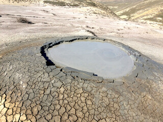 Active mud volcano in Azerbaijan. Absheron Peninsula. Crater of the mud volcano.