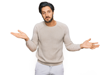 Young hispanic man wearing casual clothes clueless and confused expression with arms and hands raised. doubt concept.