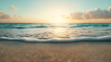 Fototapeta premium A serene beach scene at sunset, featuring gentle waves lapping at the shore under a colorful sky.
