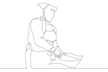 Woman chef prepares food in the restaurant kitchen. Chef cook in uniform.One continuous drawing line  logo single hand drawn art doodle isolated minimal illustration.