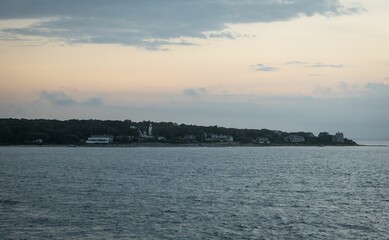 Seascape with lighthouse and pastel sky