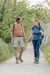 Obraz premium Senior couple holding hands while hiking in madrid, spain