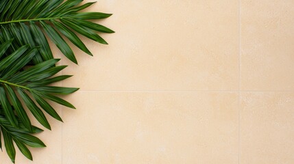 Tropical palm leaves on a sandy tile background
