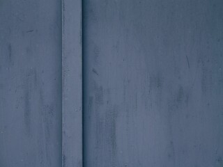 Dark blue door detail with dirty paint