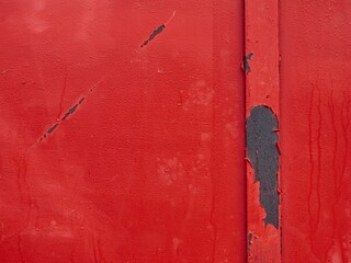 Savage red detail of metal door, with multiple rust wounds