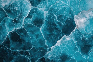 Intricate patterns of cracked ice create stunning, icy blue mosa