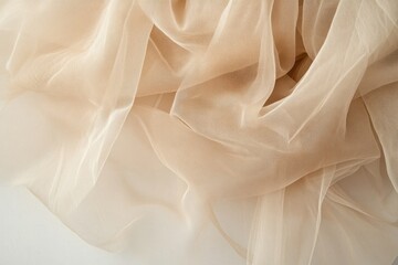 Fototapeta premium Soft, flowing fabric showcases delicate textures and warm, neutr