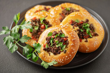 Middle Eastern Lamb Flatbread.Homemade  yeast dough flatbread with meat mince, onion, tomato and parsley.